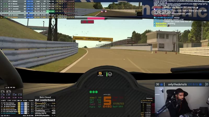 Cockpit view at Suzuka with the timing tower and chat on screen